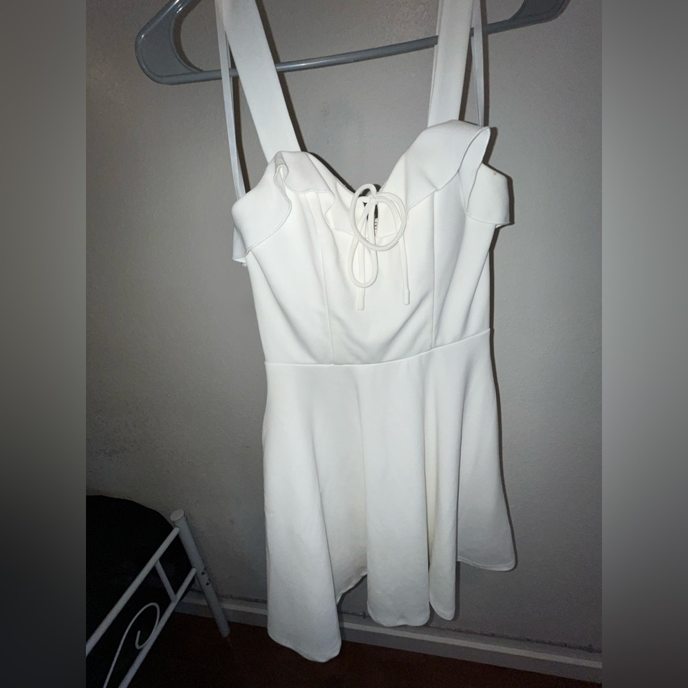 classic white dress with side pockets on the skirt area